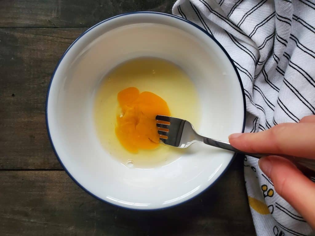 whisking the egg in a bowl