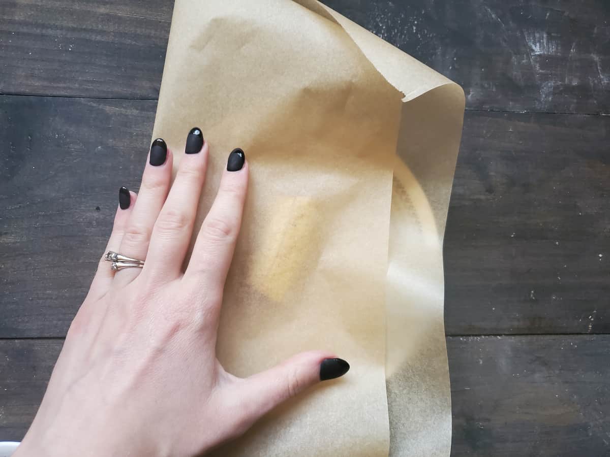 Folded over parchment paper with a plantain in between.