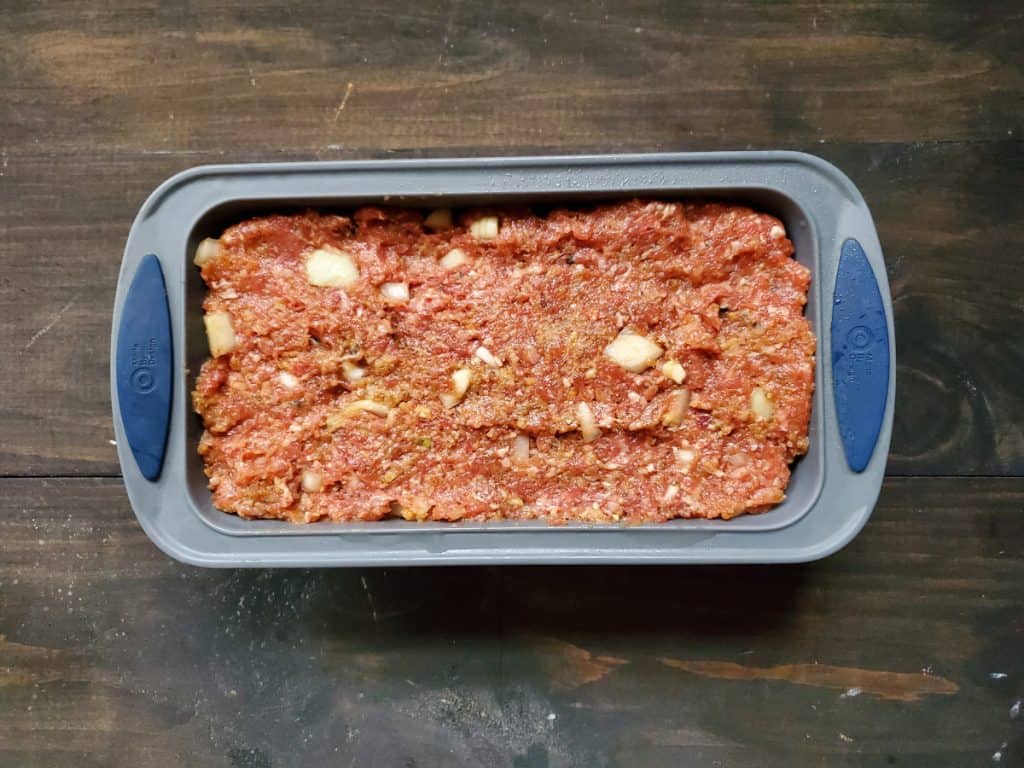 meat mixture inside a bread pan