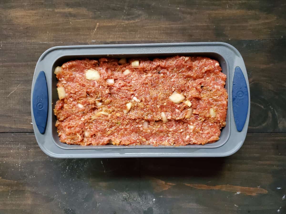 The meatloaf mixture in a baking dish ready to be baked.