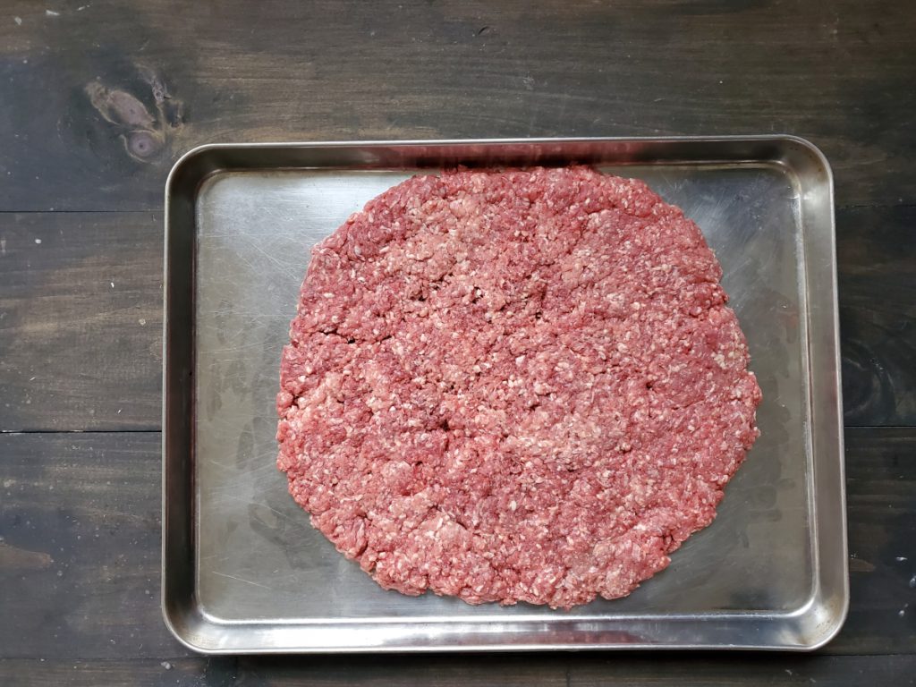 Meat flattened on a pan