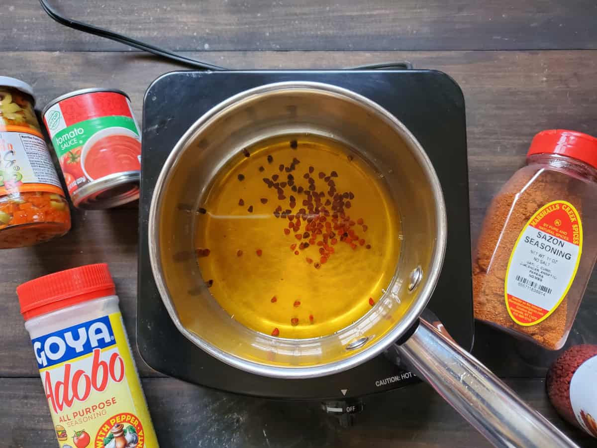 The color seeping into the oil in the saucepan.