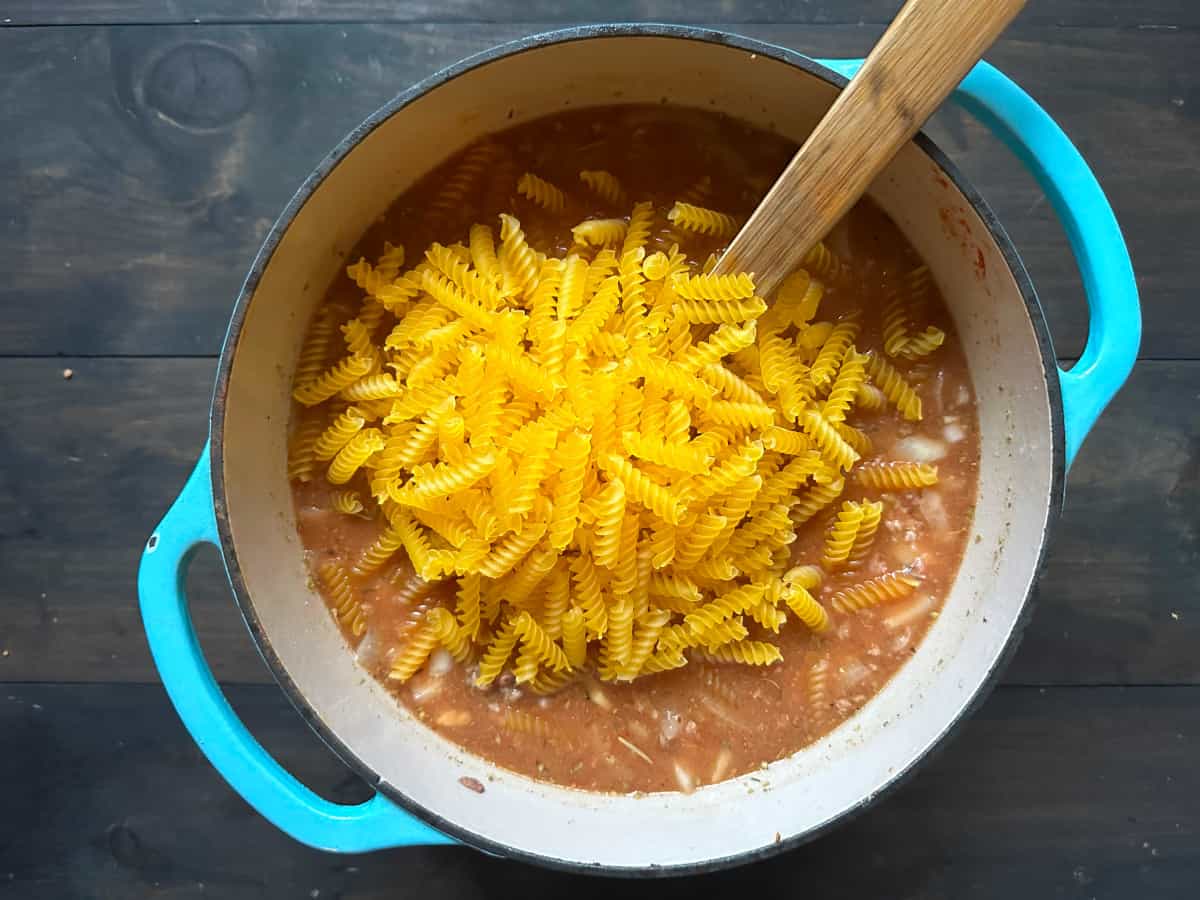 The pasta added to the pot.