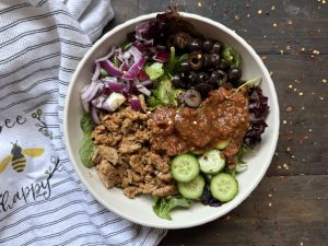 Healthy turkey burrito bowls with a towel.