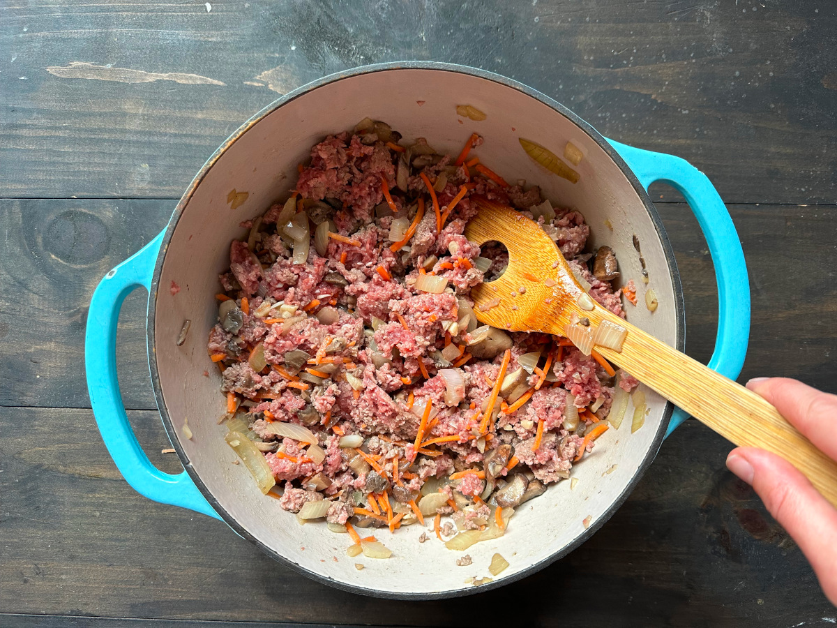 A dish sautéing the meat and vegetables.
