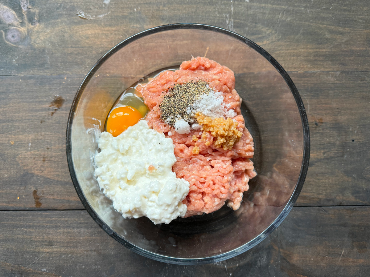 The ingredients in a glass bowl ready to be mixed.