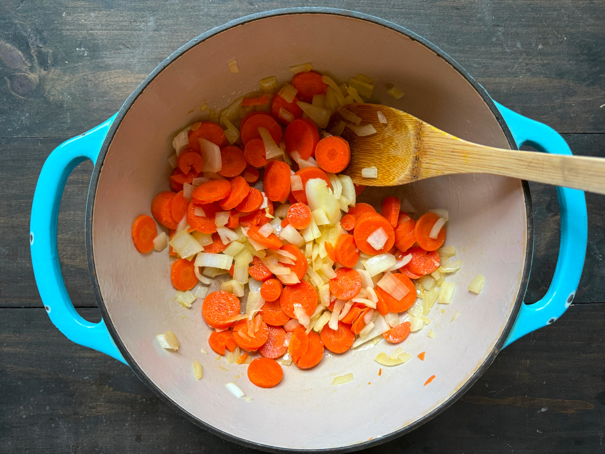 Sautéing the veggies in a pot.